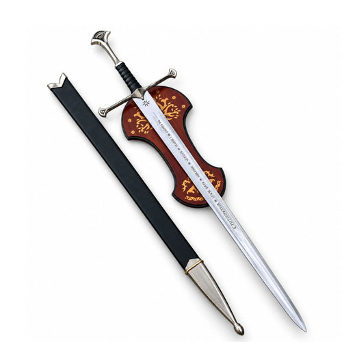A decorative sword with a silver blade engraved with 'CORNELIUS', a brown hilt featuring gold floral scrollwork, and a black scabbard, shown on a plain white background.