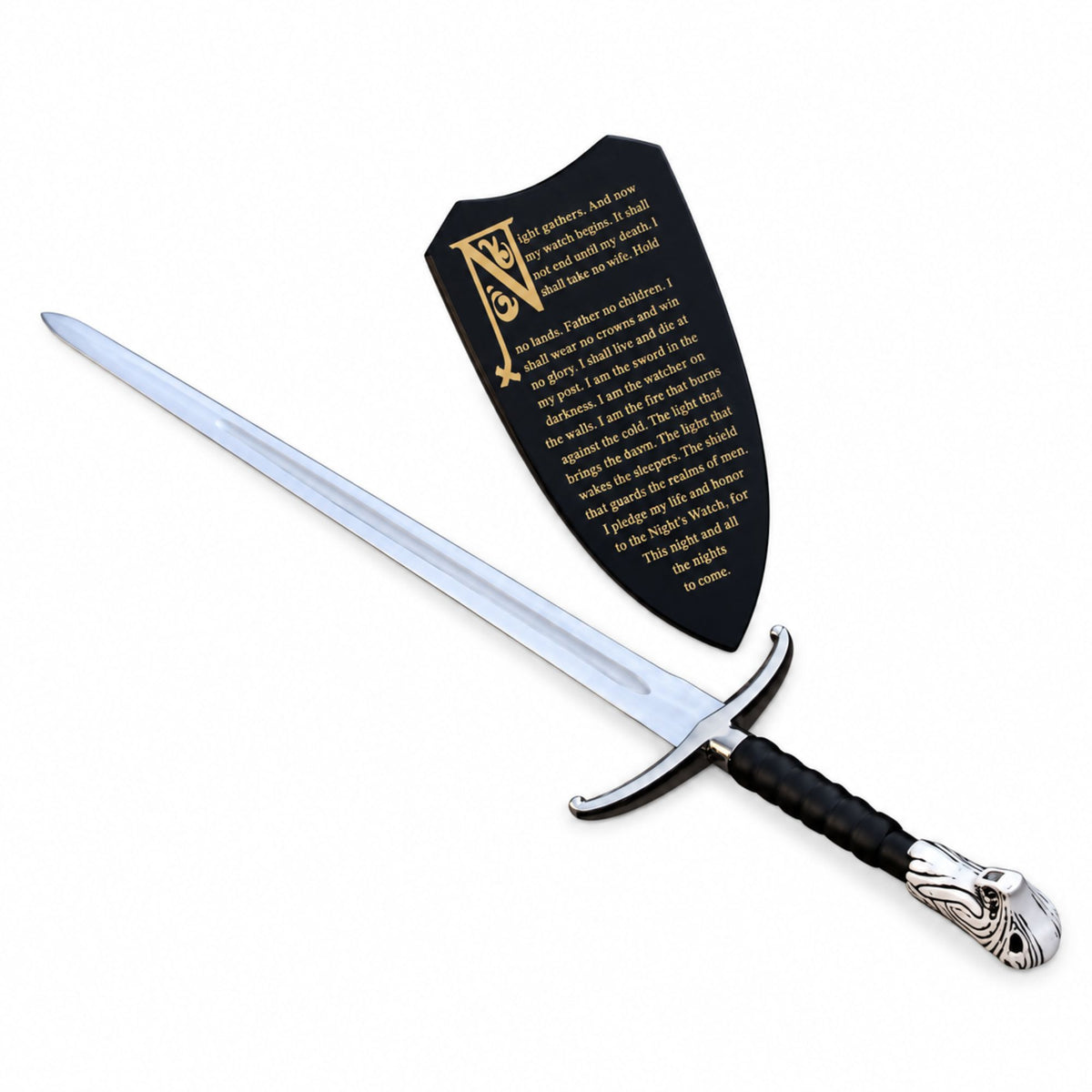 A medieval-style sword with a silver blade, black wrapped handle, and silver pommel, displayed diagonally next to a black shield-shaped plaque with gold lettering on a white background.